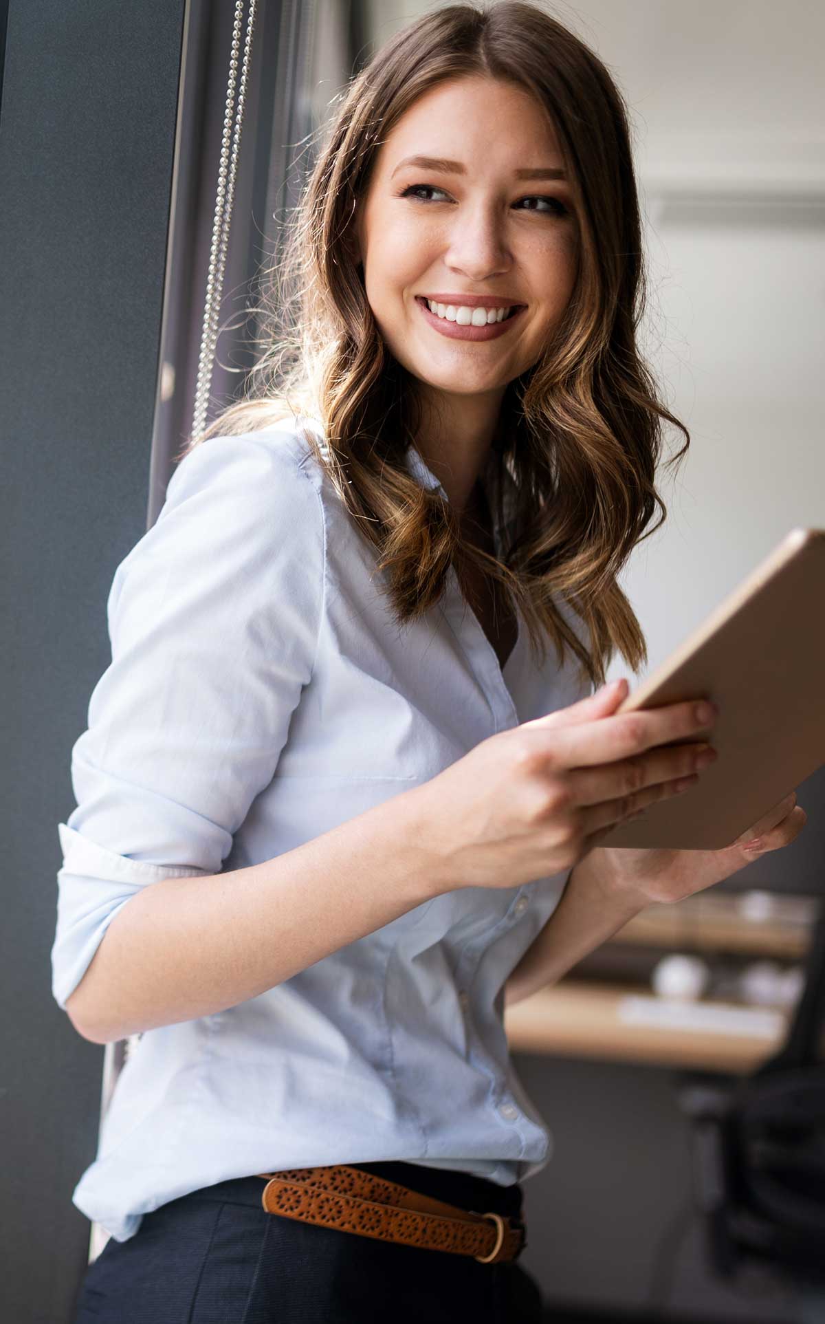 Smiling woman with notepad